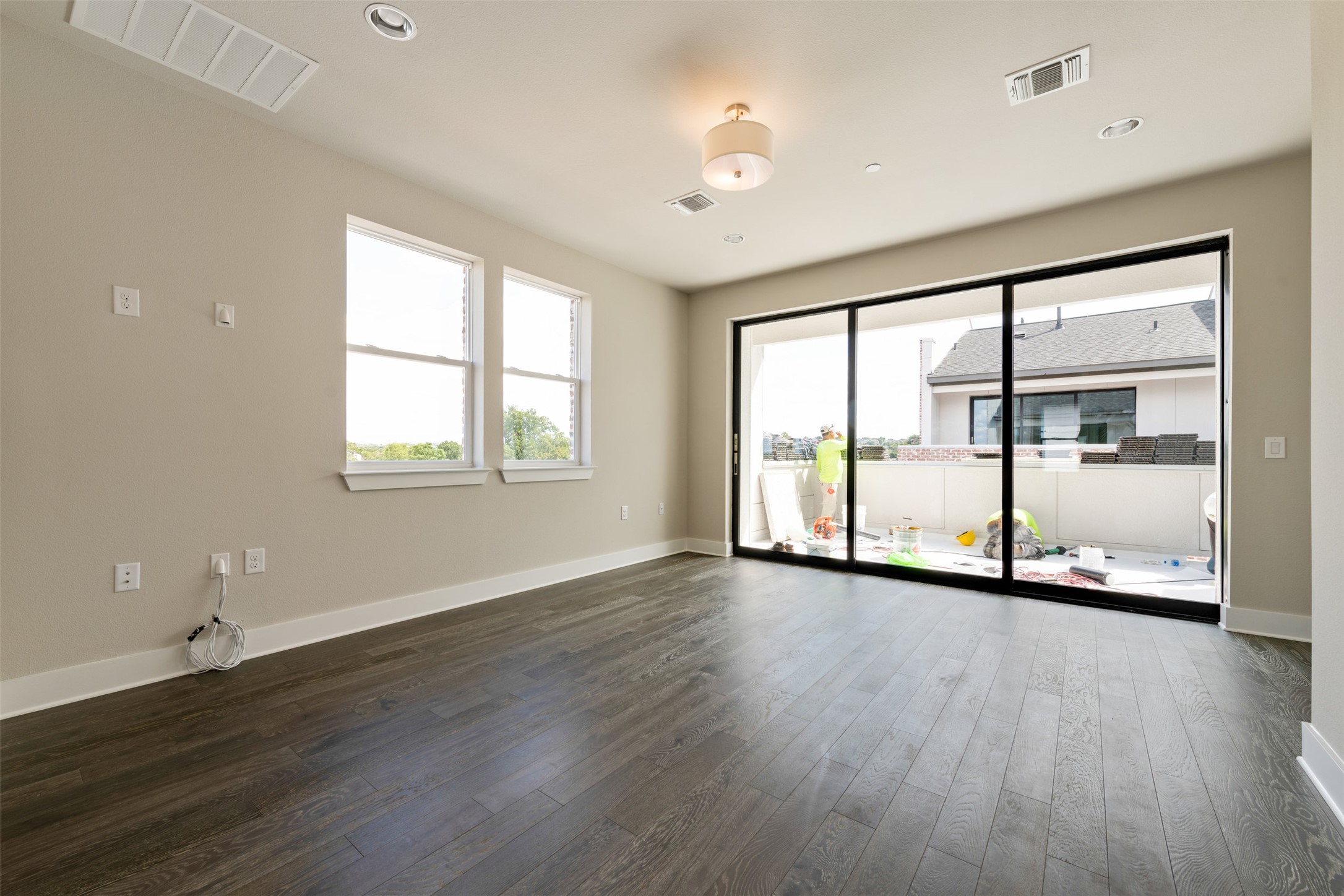 1308 Tinnin Ford Road, Unit 1 Austin, TX 78741 - Photo 16 of 21 wooden floor in an empty room with a window