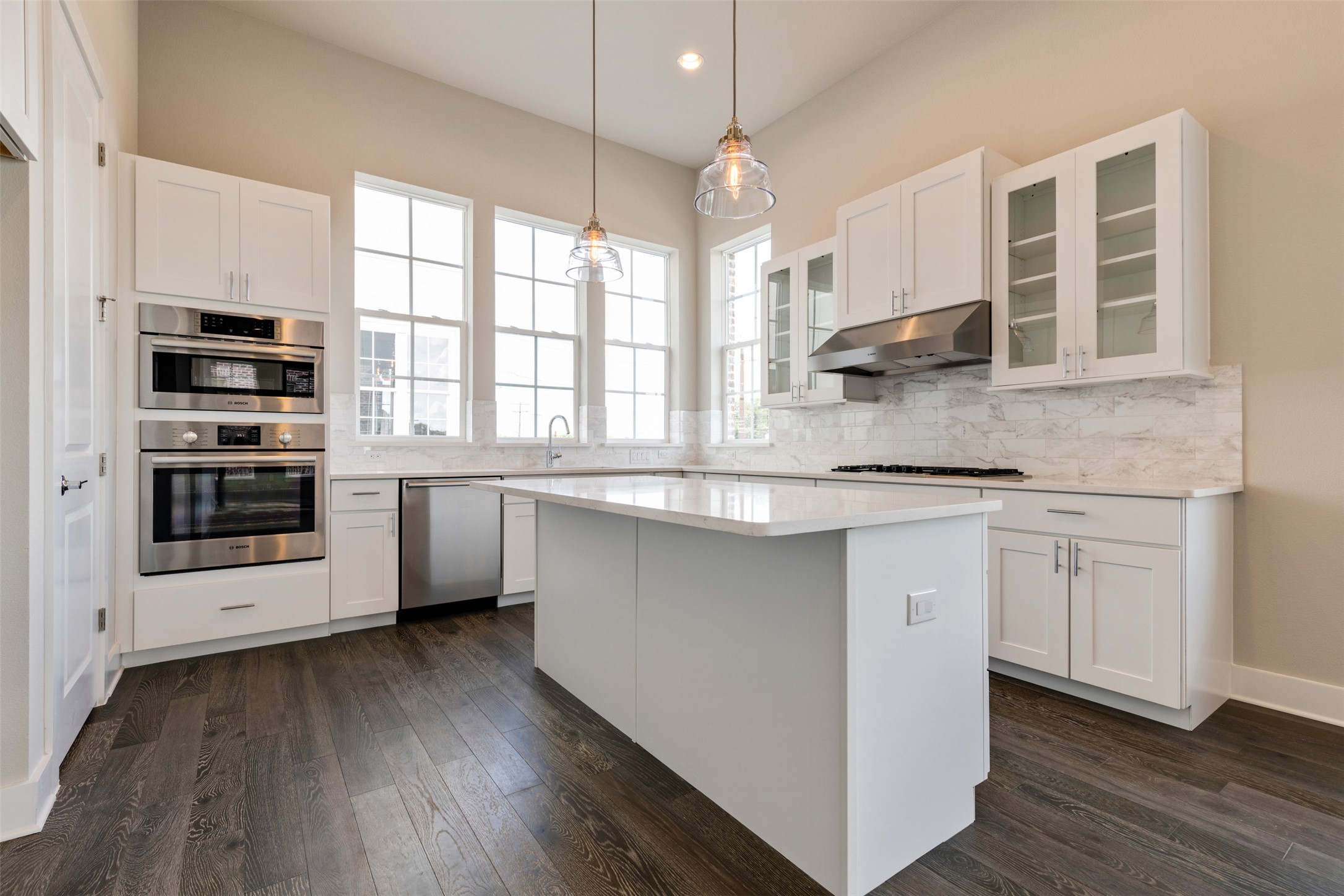1308 Tinnin Ford Road, Unit 1 Austin, TX 78741 - Photo 4 of 21 a kitchen with stainless steel appliances granite countertop a stove a sink and a microwave