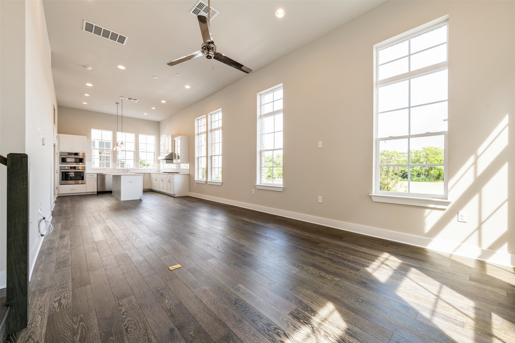 1308 Tinnin Ford Road, Unit 1 Austin, TX 78741 - Photo 8 of 21 a view of an empty room with wooden floor and a window