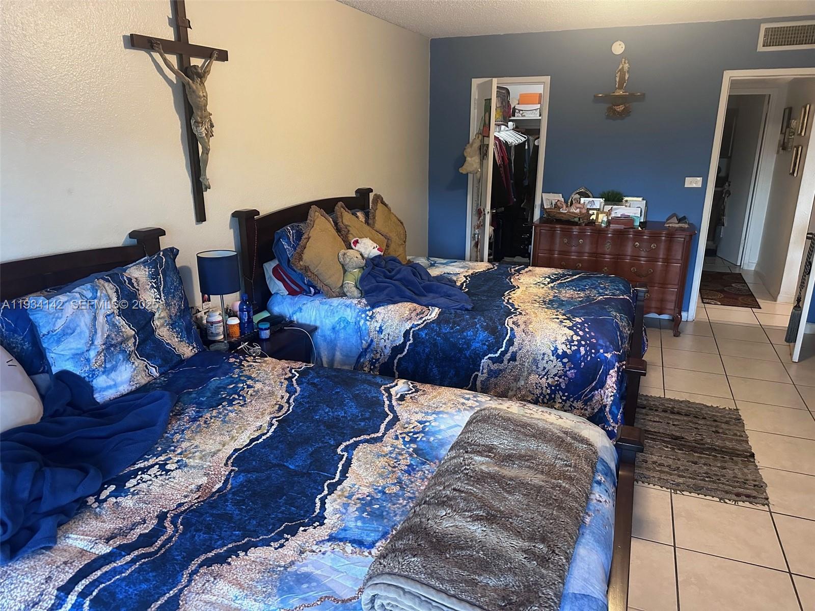 9974 Southwest 88th Street, Unit 1028 Miami, FL 33176 - Photo 11 of 24 a bedroom with bed and wooden floor