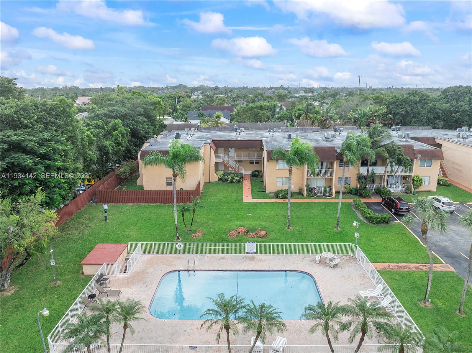 9974 Southwest 88th Street, Unit 1028 Miami, FL 33176 - Photo 19 of 24 a view of a city from a garden