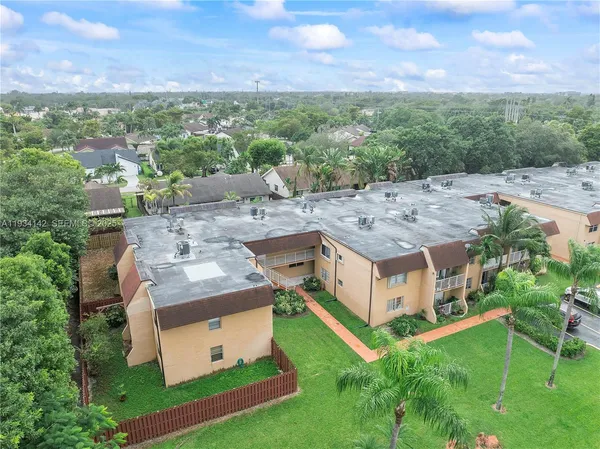 a aerial view of a house with a big yard