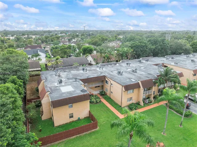 a aerial view of a house with a big yard