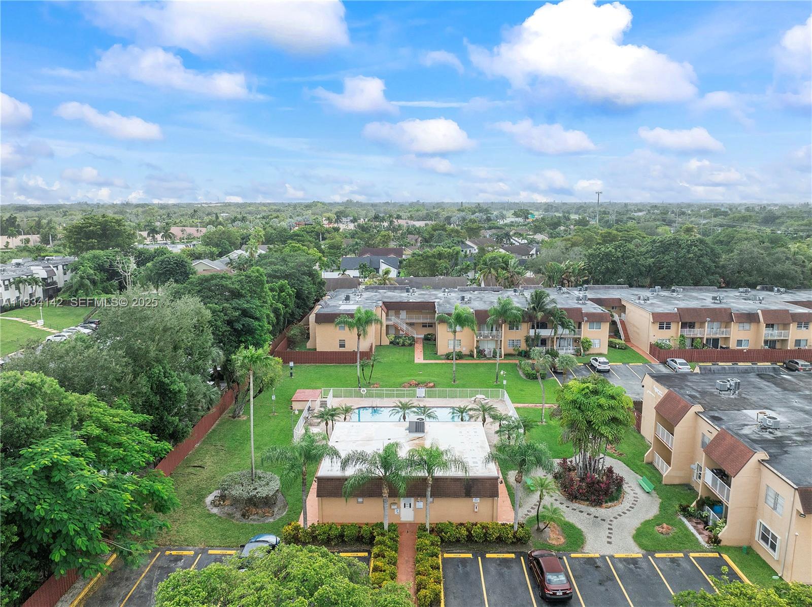 9974 Southwest 88th Street, Unit 1028 Miami, FL 33176 - Photo 24 of 24 a view of a city with a building in the background