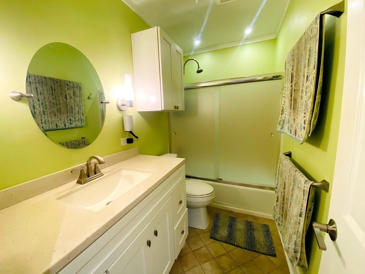 3788 Lower Honoapiilani Road, Unit F103 Lahaina, HI 96761 - Photo 15 of 25 a bathroom with a sink and a mirror