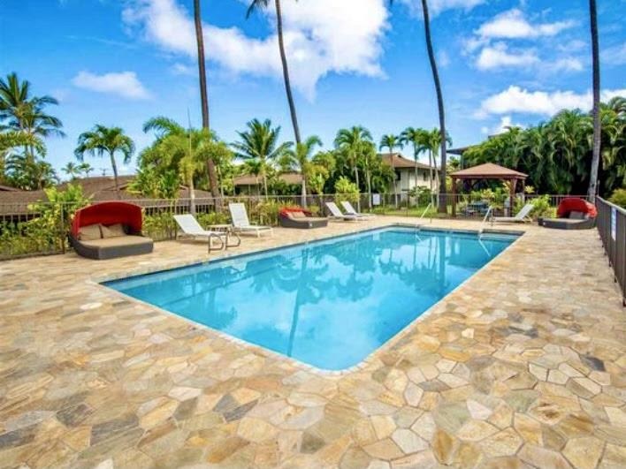3788 Lower Honoapiilani Road, Unit F103 Lahaina, HI 96761 - Photo 18 of 25 a view of a swimming pool with a lounge chair
