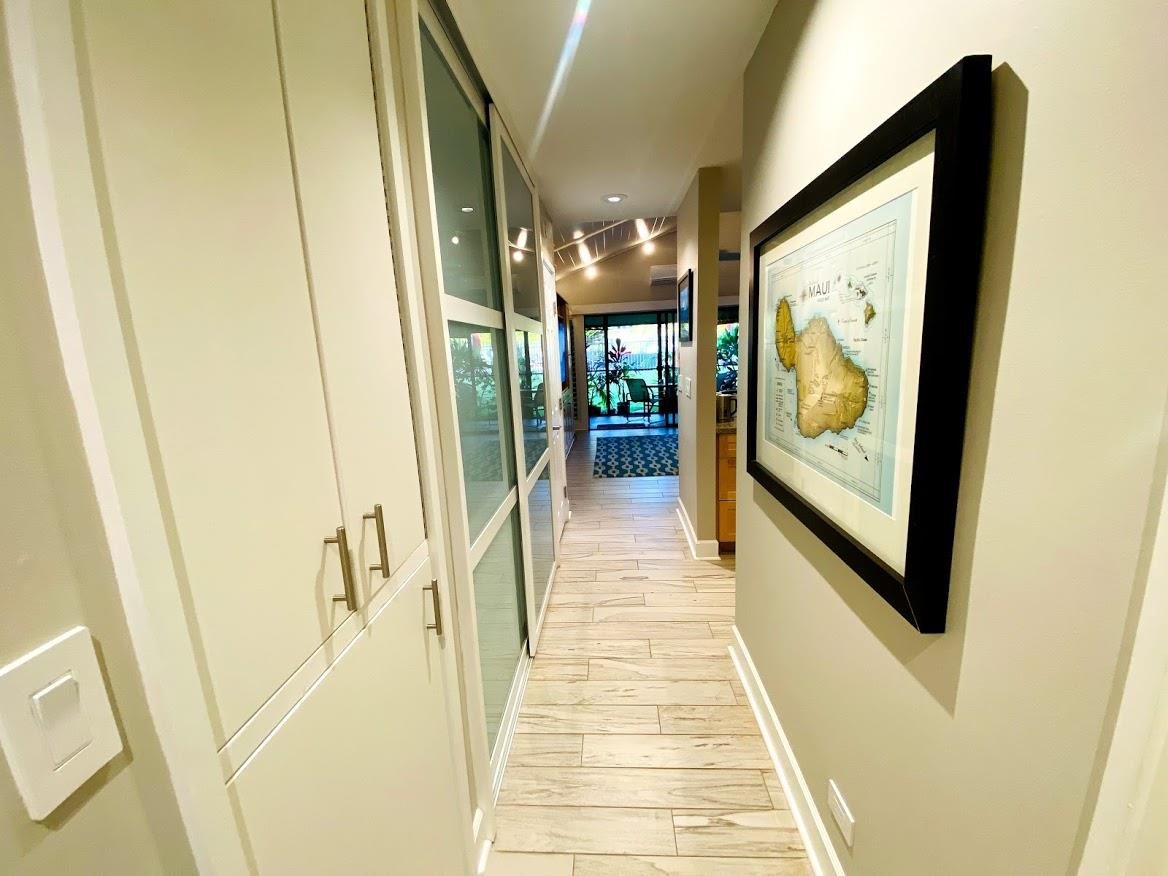 3788 Lower Honoapiilani Road, Unit F103 Lahaina, HI 96761 - Photo 2 of 25 a hallway with a large window