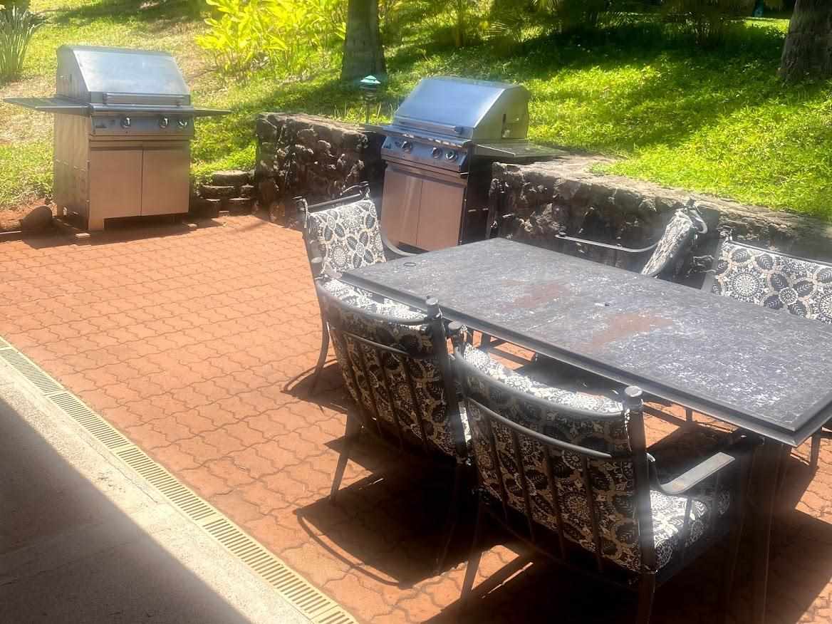 3788 Lower Honoapiilani Road, Unit F103 Lahaina, HI 96761 - Photo 21 of 25 a view of a patio with two chairs and a table
