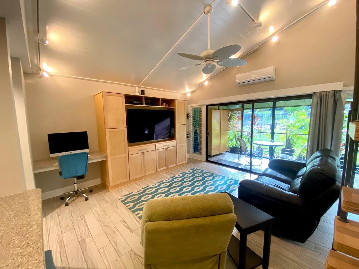 3788 Lower Honoapiilani Road, Unit F103 Lahaina, HI 96761 - Photo 5 of 25 a living room with furniture and a flat screen tv