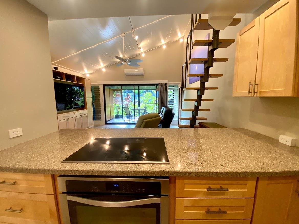 3788 Lower Honoapiilani Road, Unit F103 Lahaina, HI 96761 - Photo 6 of 25 a kitchen with granite countertop a stove and a sink