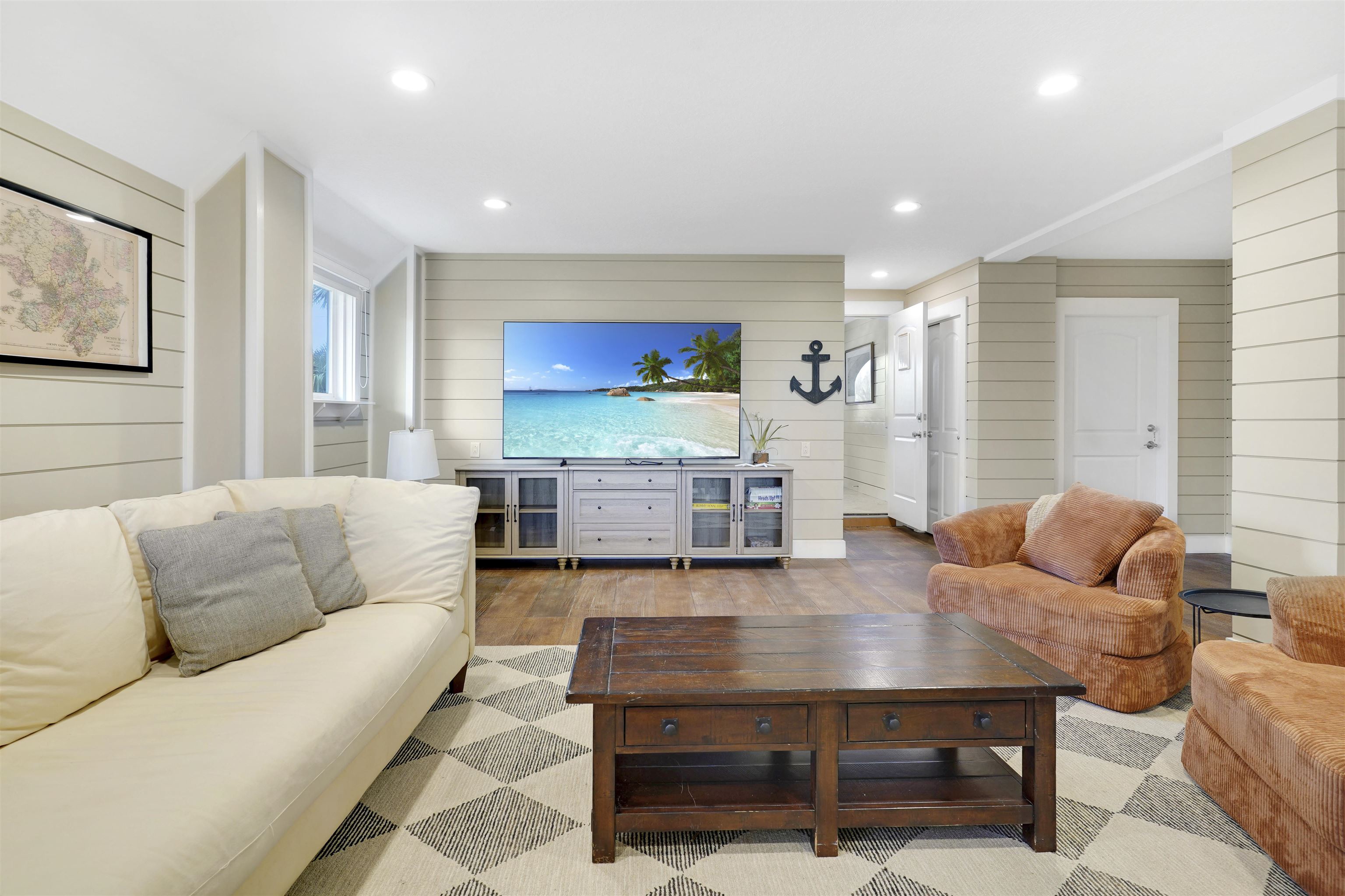 1 2nd Lane St. Augustine Beach, FL 32080 - Photo 11 of 81 a living room with furniture and a flat screen tv