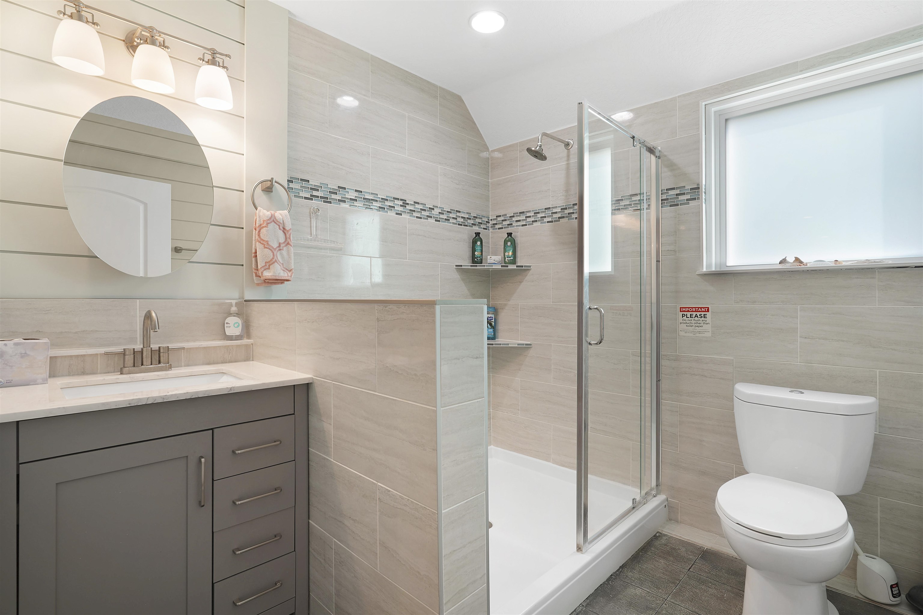 1 2nd Lane St. Augustine Beach, FL 32080 - Photo 14 of 81 a bathroom with a granite countertop sink toilet and shower