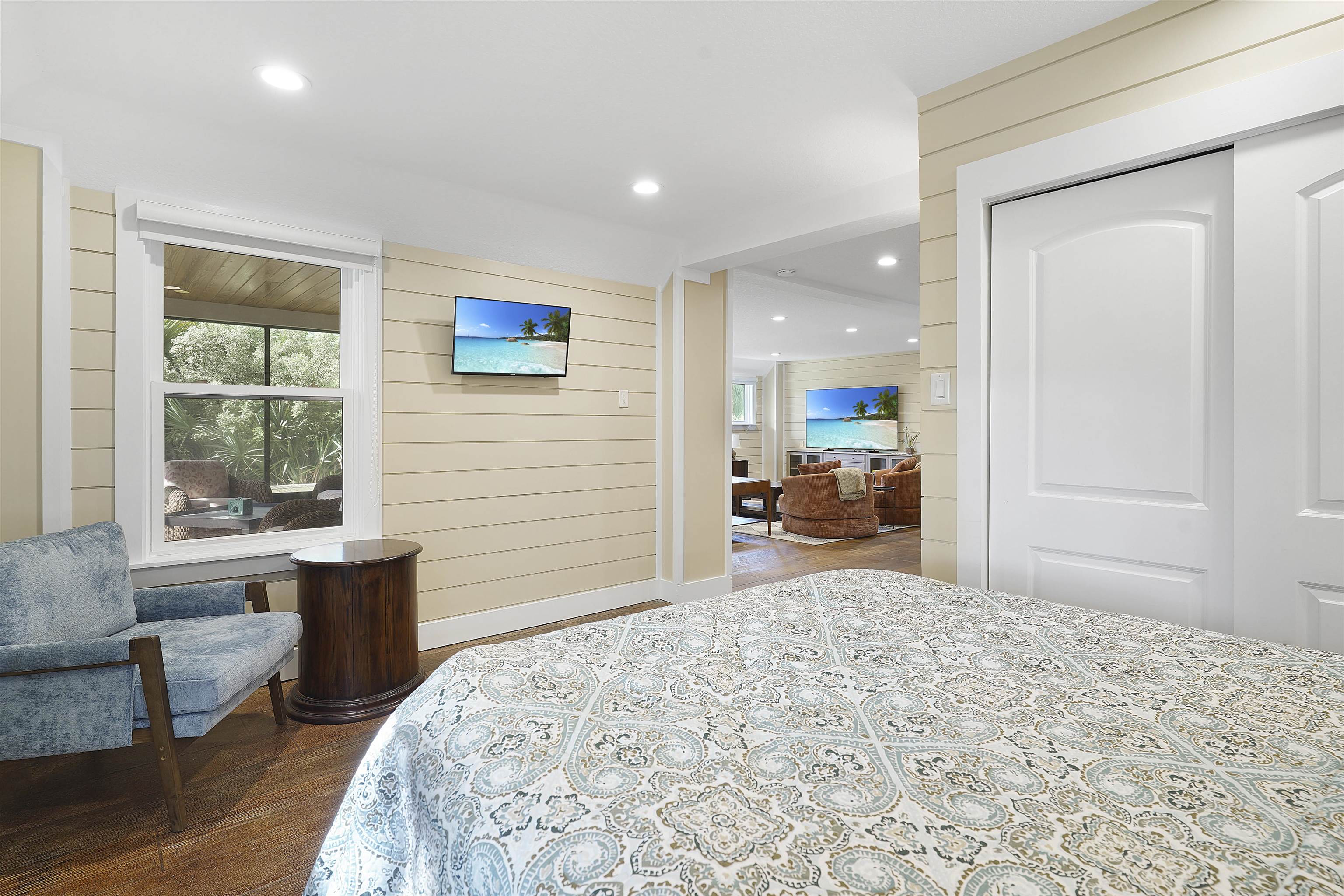 1 2nd Lane St. Augustine Beach, FL 32080 - Photo 16 of 81 a bedroom with a bed and wooden floor