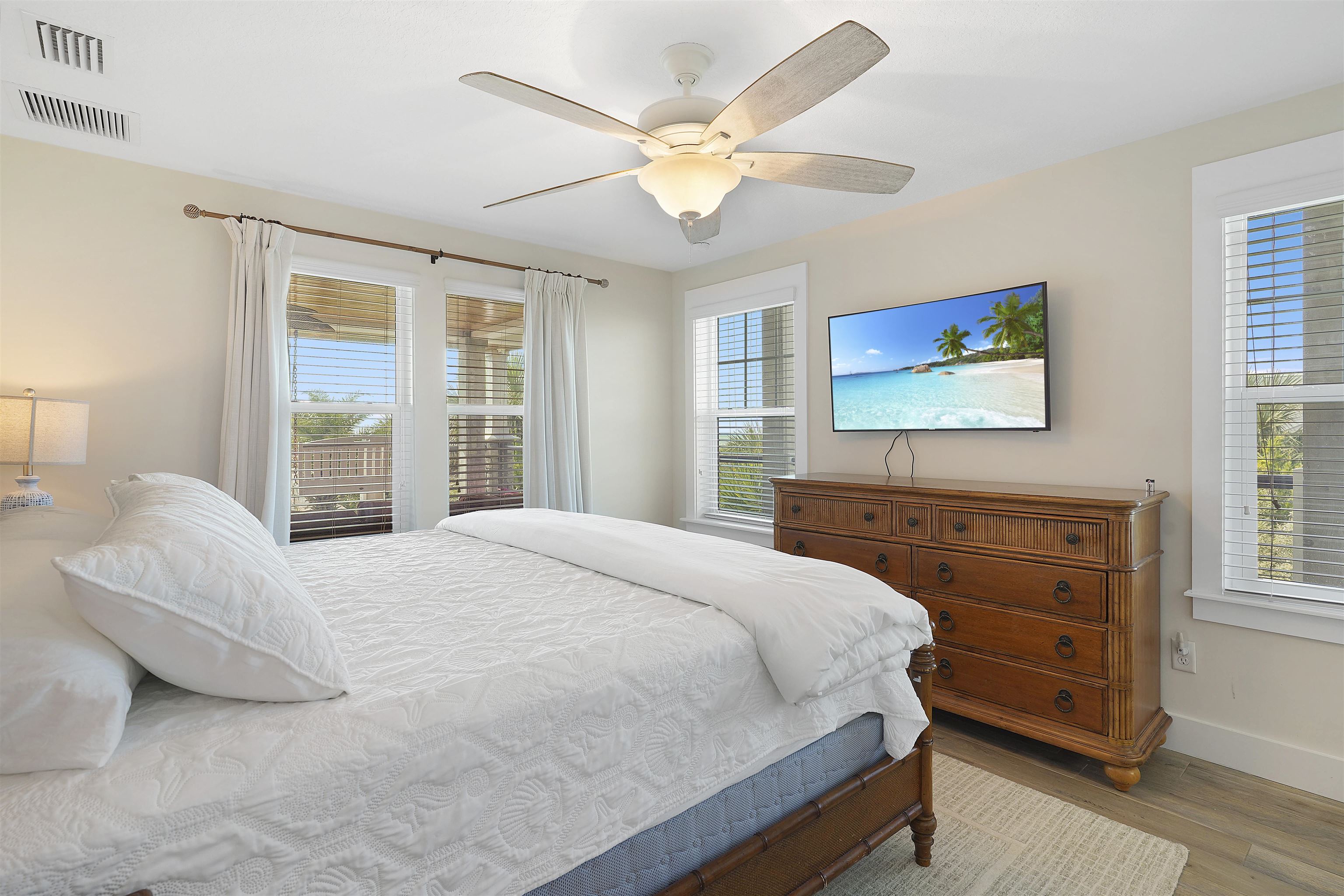 1 2nd Lane St. Augustine Beach, FL 32080 - Photo 31 of 81 a bedroom with a bed a window and a dresser