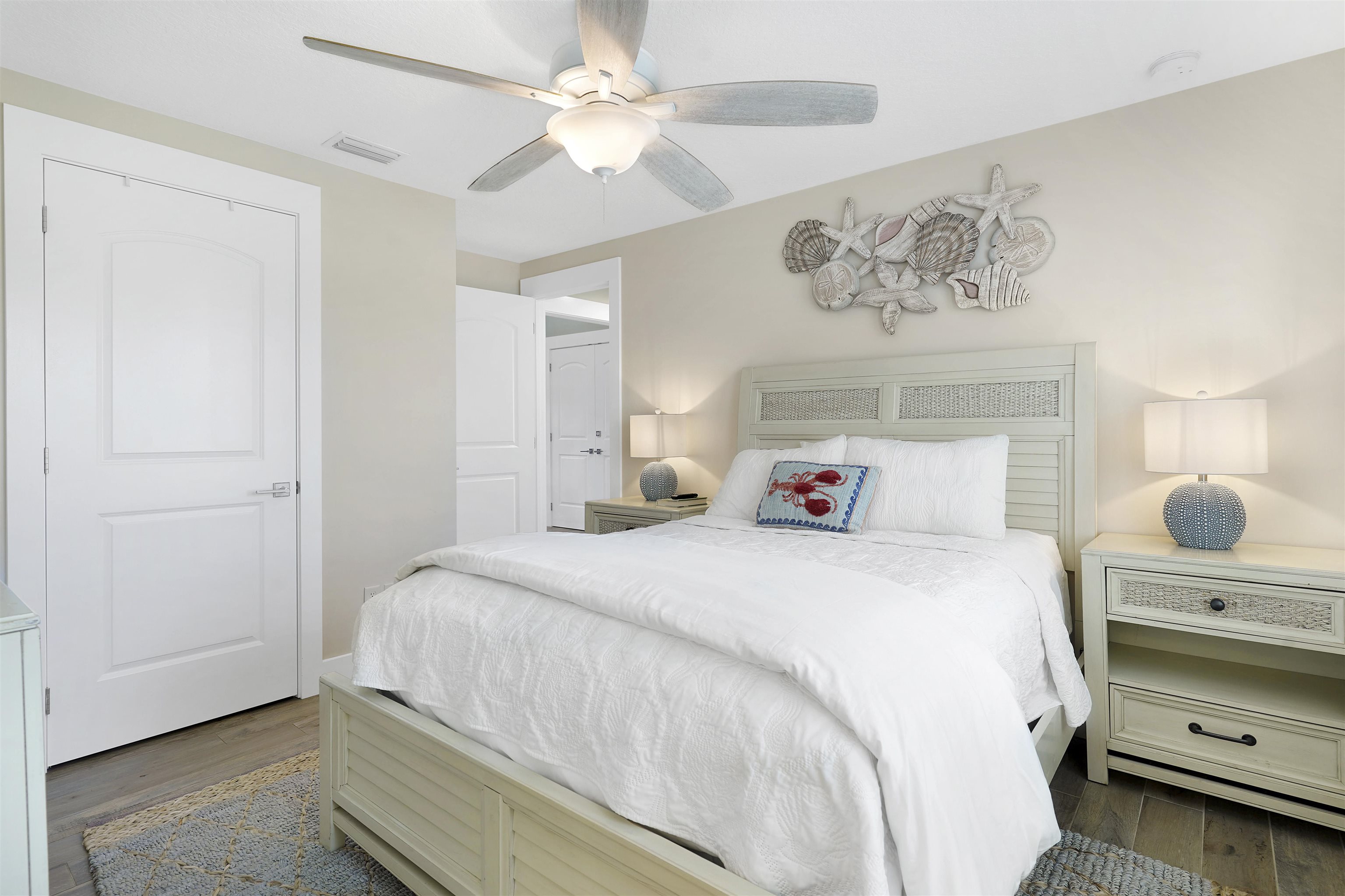 1 2nd Lane St. Augustine Beach, FL 32080 - Photo 39 of 81 a bedroom with a bed and a chandelier