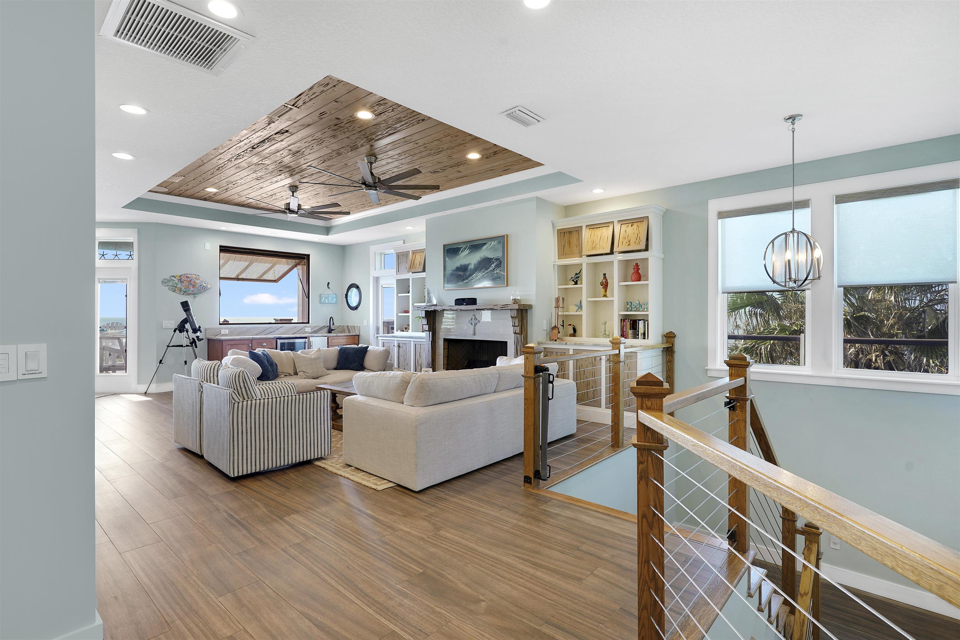 1 2nd Lane St. Augustine Beach, FL 32080 - Photo 41 of 81 a living room with furniture wooden floor and a fireplace