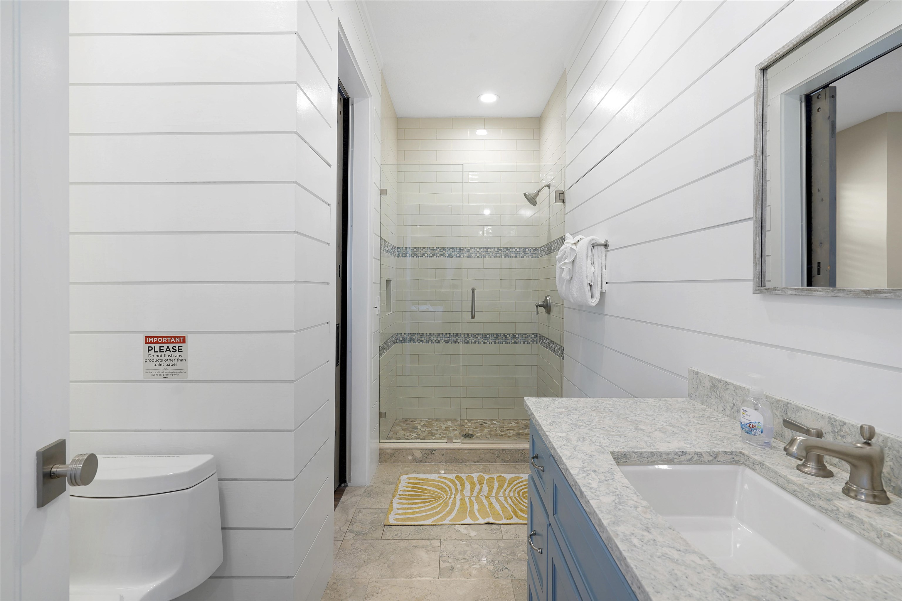 1 2nd Lane St. Augustine Beach, FL 32080 - Photo 48 of 81 a bathroom with a granite countertop sink a toilet and shower