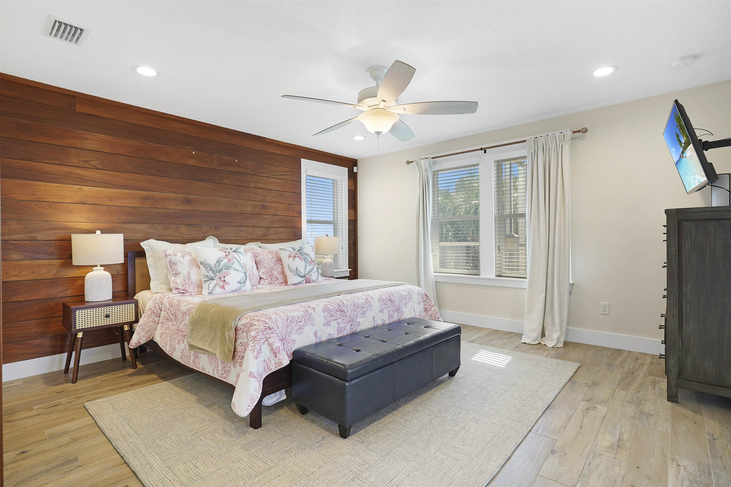 1 2nd Lane St. Augustine Beach, FL 32080 - Photo 5 of 81 a spacious bedroom with a bed and a flat screen tv