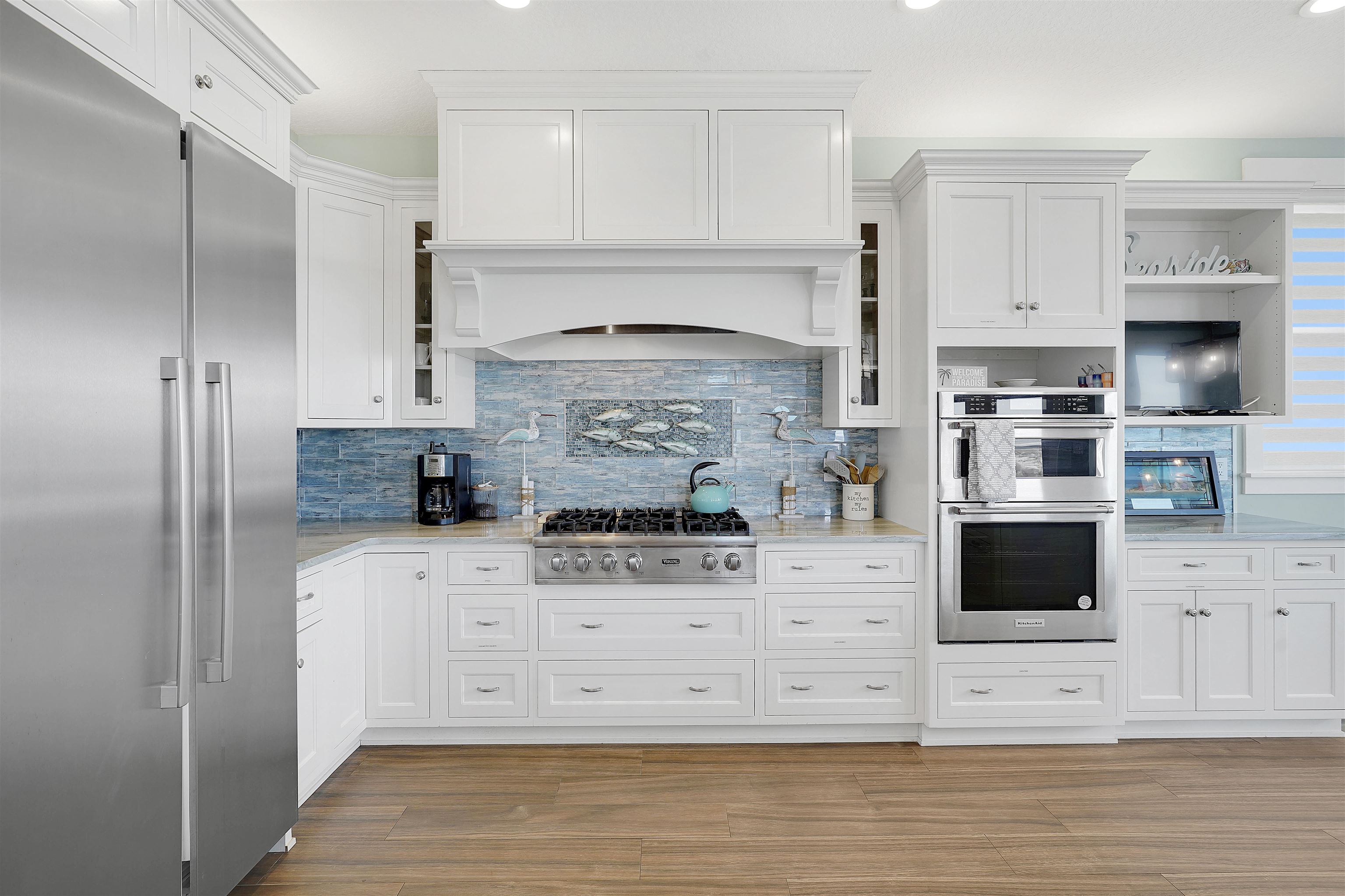 1 2nd Lane St. Augustine Beach, FL 32080 - Photo 52 of 81 a kitchen with stainless steel appliances kitchen island granite countertop a stove and a refrigerator