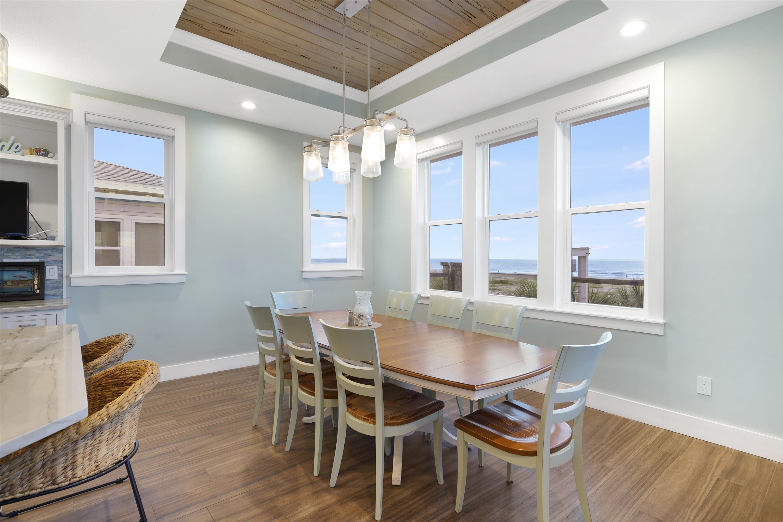 1 2nd Lane St. Augustine Beach, FL 32080 - Photo 54 of 81 a dining room with furniture a chandelier and wooden floor