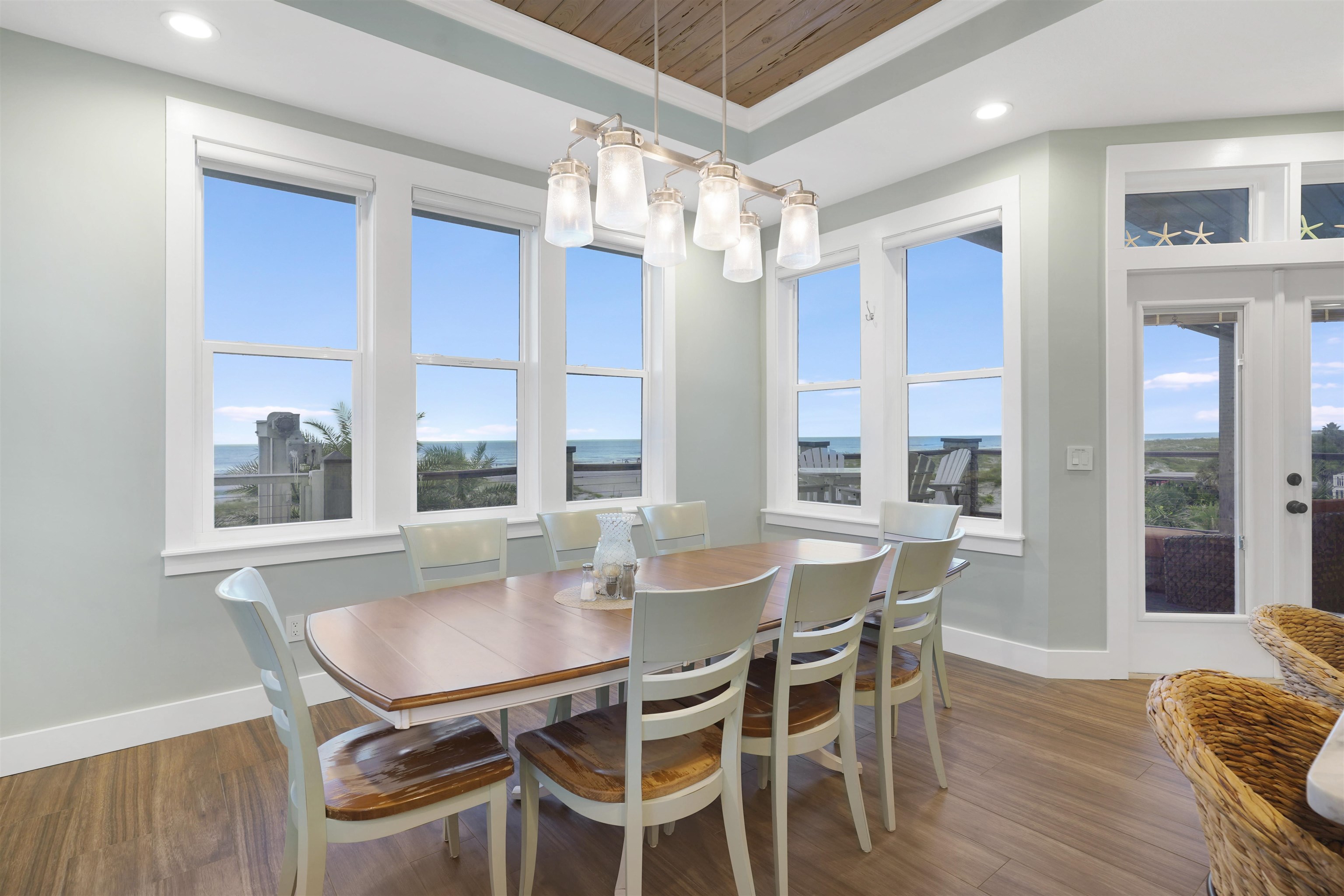 1 2nd Lane St. Augustine Beach, FL 32080 - Photo 55 of 81 a dining room with furniture a chandelier and wooden floor