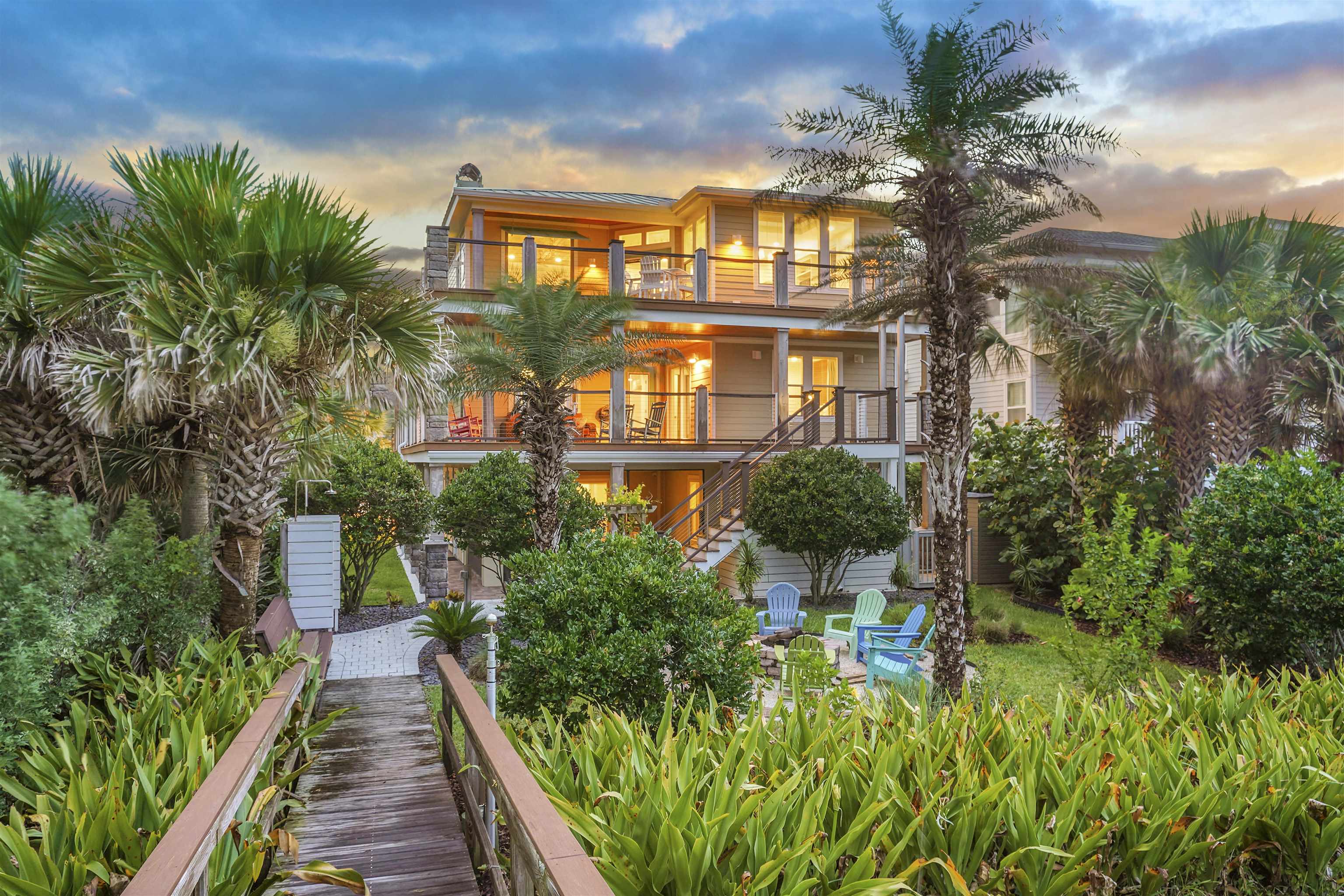 1 2nd Lane St. Augustine Beach, FL 32080 - Photo 69 of 81 a view of a multi story residential apartment building with a yard