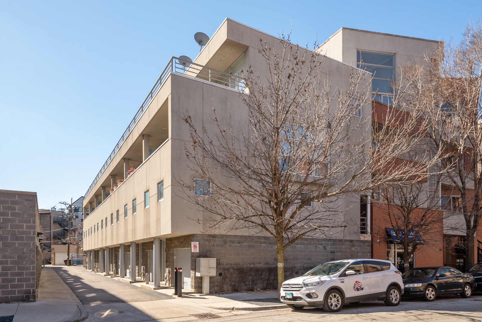 943 West Huron Street, Unit E Chicago, IL 60642 - Photo 1 of 22 a view of street with parked cars