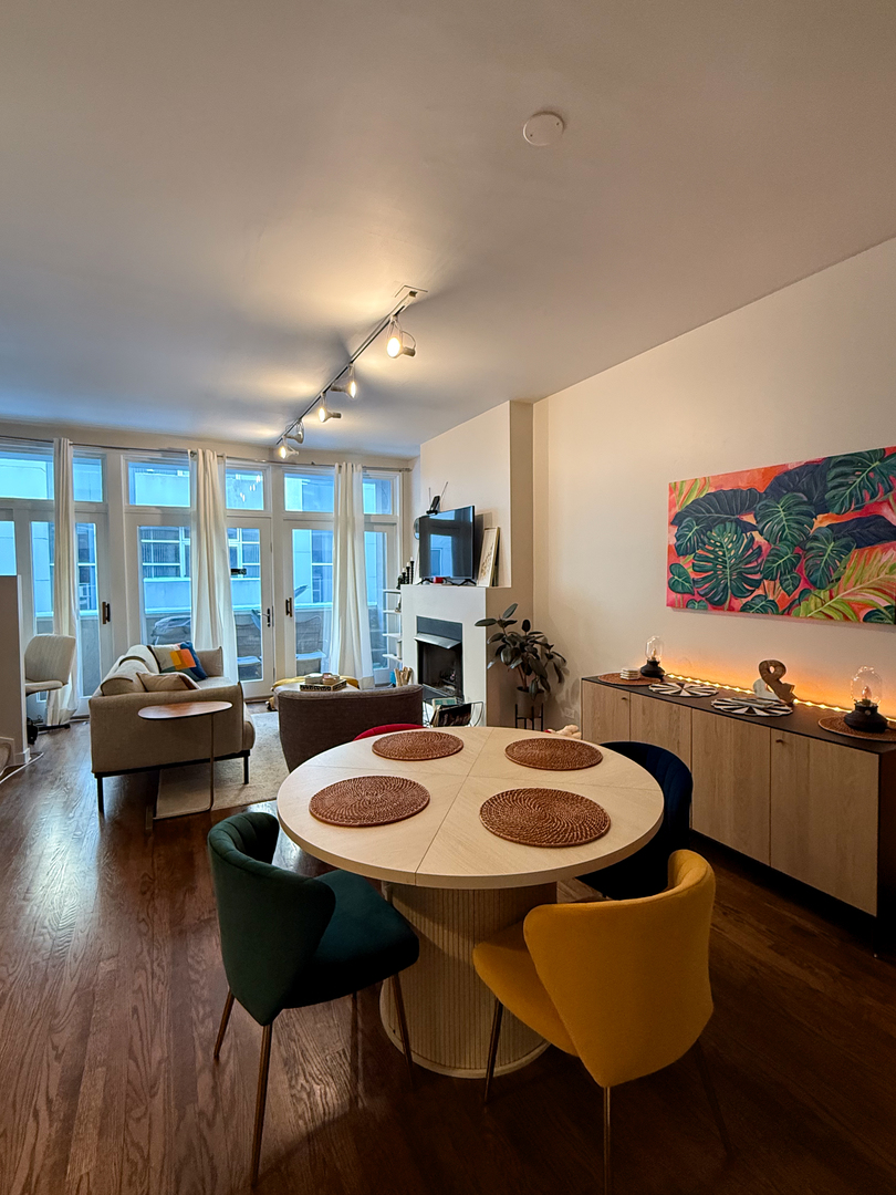 943 West Huron Street, Unit E Chicago, IL 60642 - Photo 12 of 22 a dining room with furniture and wooden floor