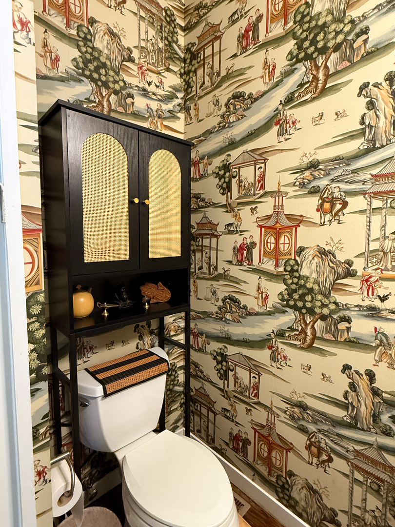 943 West Huron Street, Unit E Chicago, IL 60642 - Photo 19 of 22 a bathroom with a toilet sink and mirror