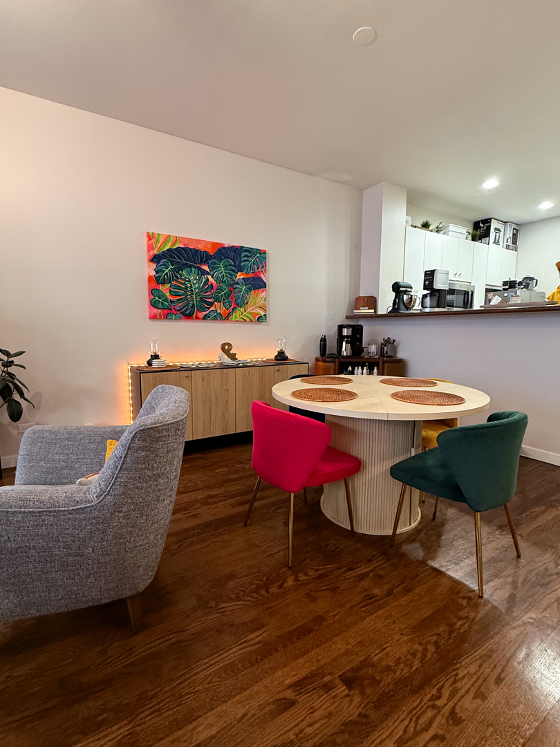 943 West Huron Street, Unit E Chicago, IL 60642 - Photo 8 of 22 a living room with furniture and a wooden floor