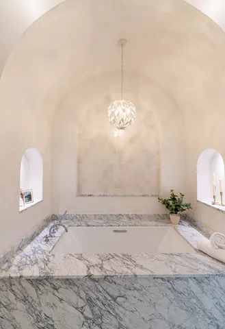 a bathroom with a granite countertop sink a toilet and a mirror