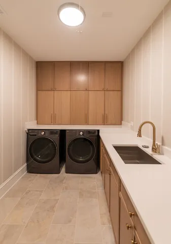 a kitchen with kitchen island granite countertop a stove a sink a oven and a dining table with wooden floor