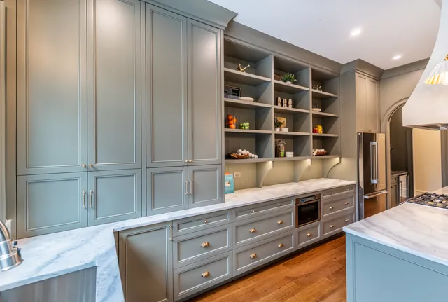 a living room with granite countertop cabinets