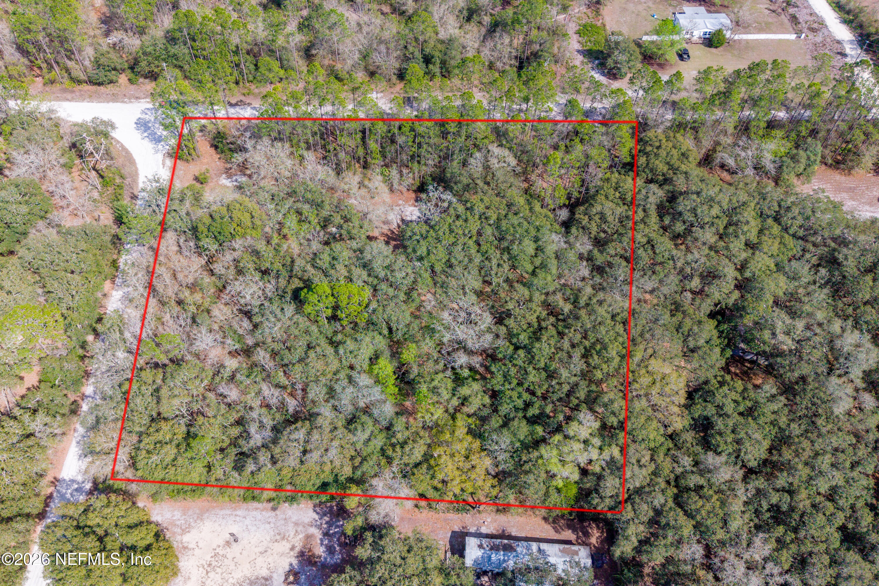 9094 Southeast 50th Avenue Hampton, FL 32044 - Photo 2 of 17 an aerial view of a houses with yard