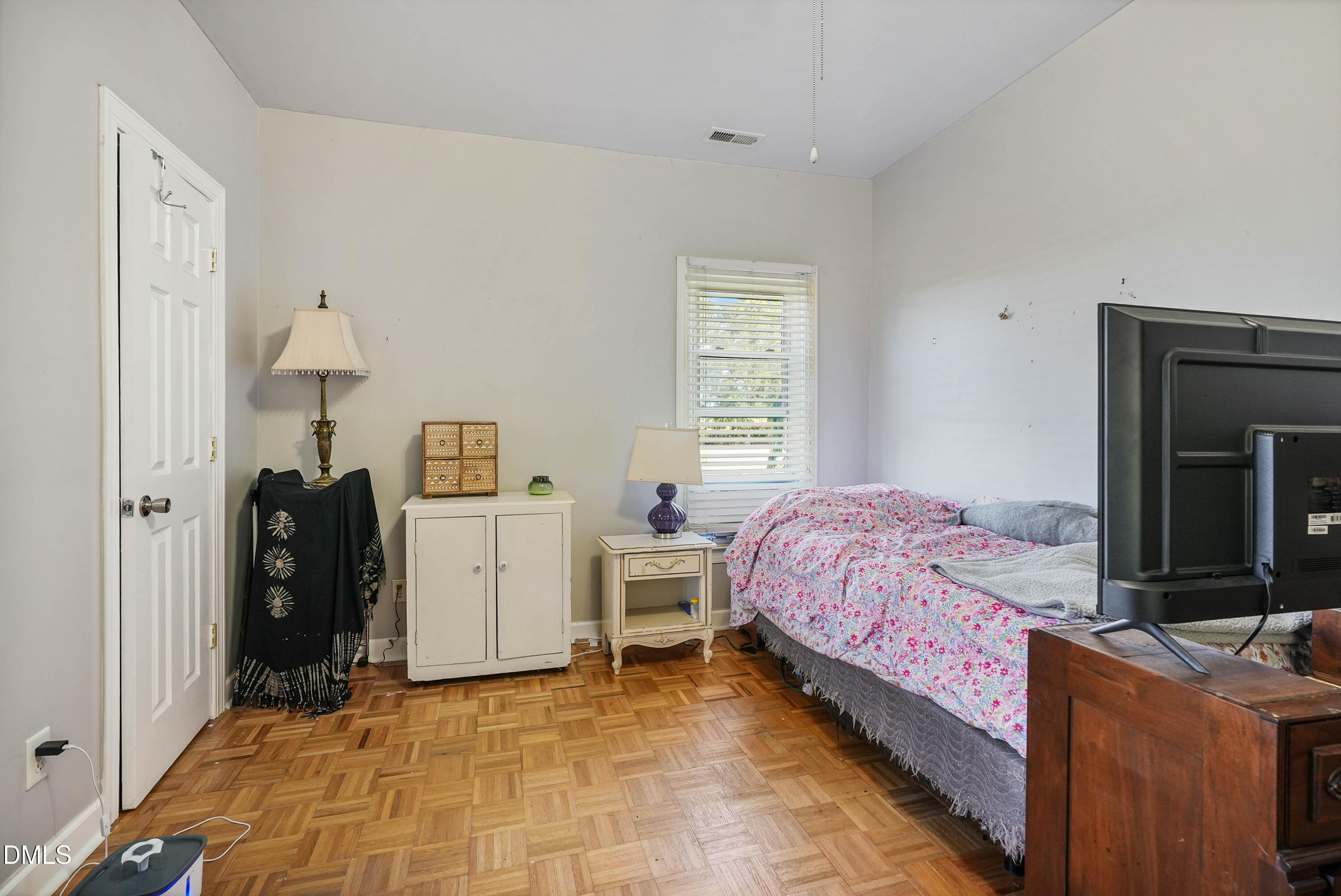 7406 Old Beulah Road Kenly, NC 27542 - Photo 20 of 30 Light-filled room featuring wood-finish flooring, white trim, and a window with blinds