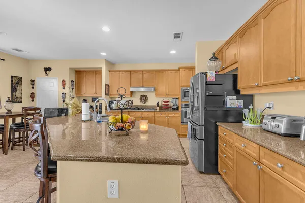 a kitchen with counter top space a sink cabinets and appliances