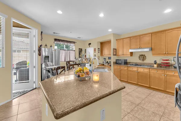 a kitchen with counter top space and appliances