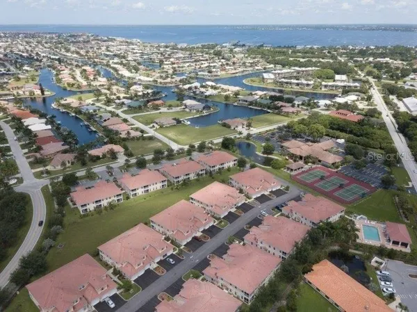 an aerial view of residential houses with outdoor space