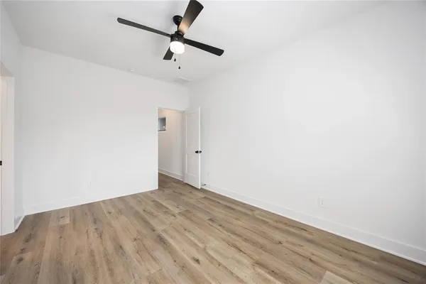 a view of room with wooden floor