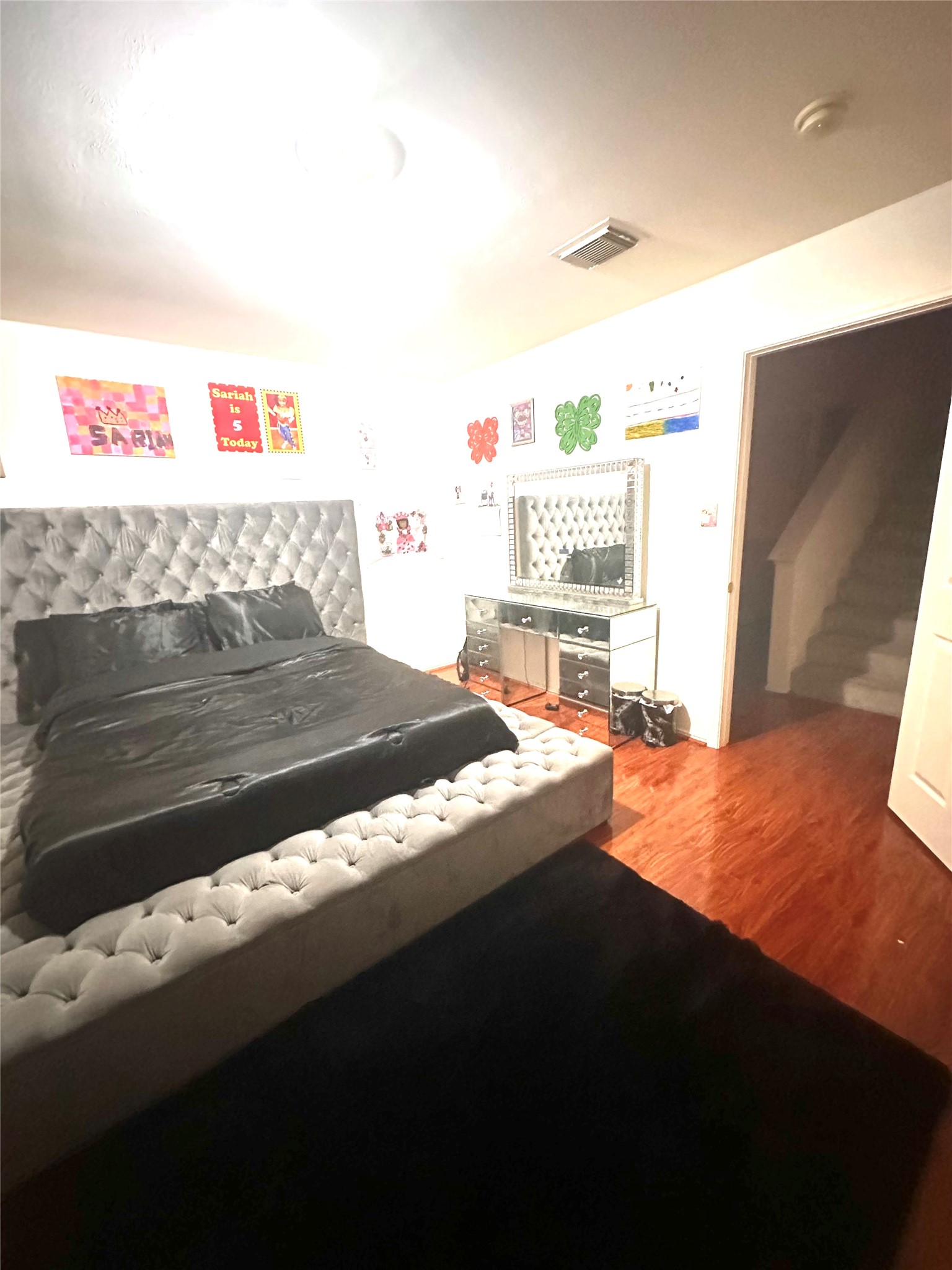 1718 Redwing Ridge Drive Houston, TX 77009 - Photo 20 of 32 a bedroom with a bed and a window