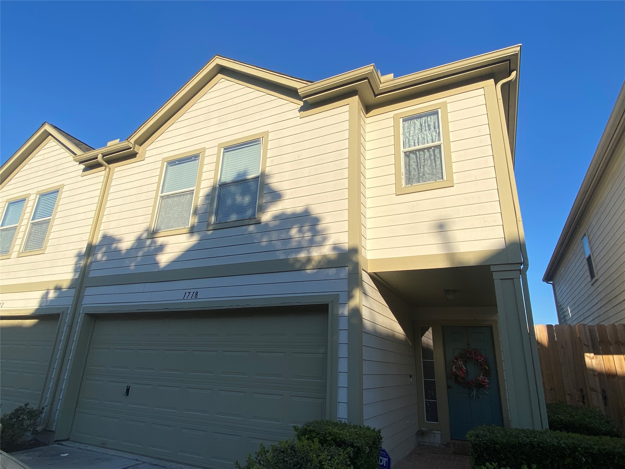 1718 Redwing Ridge Drive Houston, TX 77009 - Photo 2 of 32 a view of a house with wooden walls and a stairs
