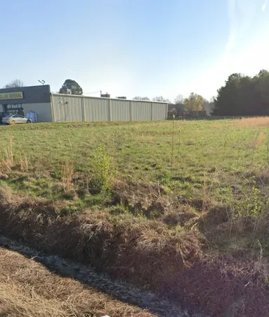 a view of a lake with a building in the background