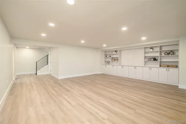 an empty room with a empty space and window