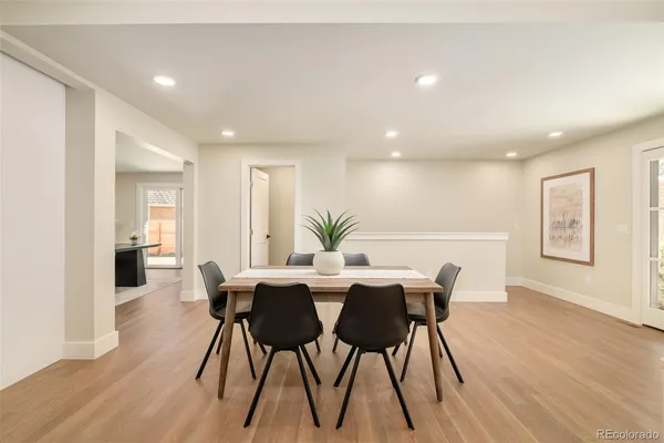 a dining room with furniture and window