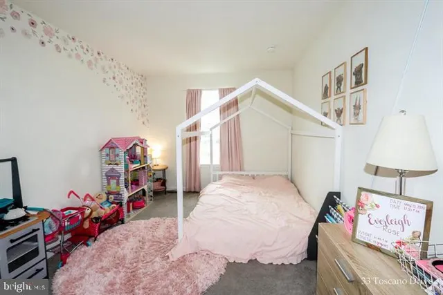 a bedroom with bed and a window