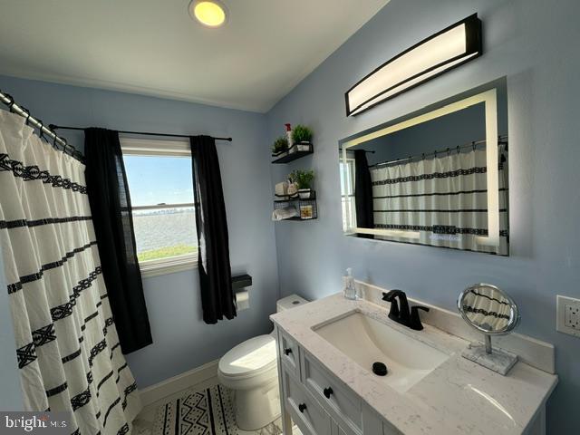 49 Delaware Drive Penns Grove, NJ 08069 - Photo 11 of 26 a bathroom with a sink toilet and mirror