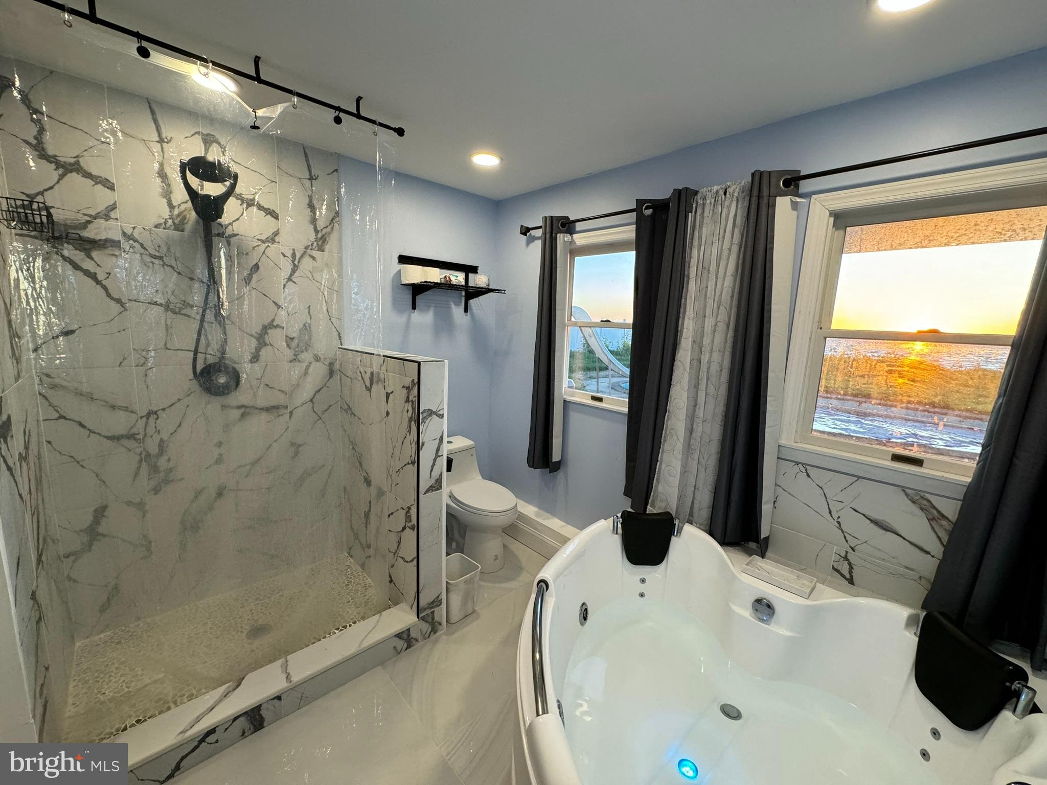 49 Delaware Drive Penns Grove, NJ 08069 - Photo 14 of 26 a bathroom with a bathtub and a shower