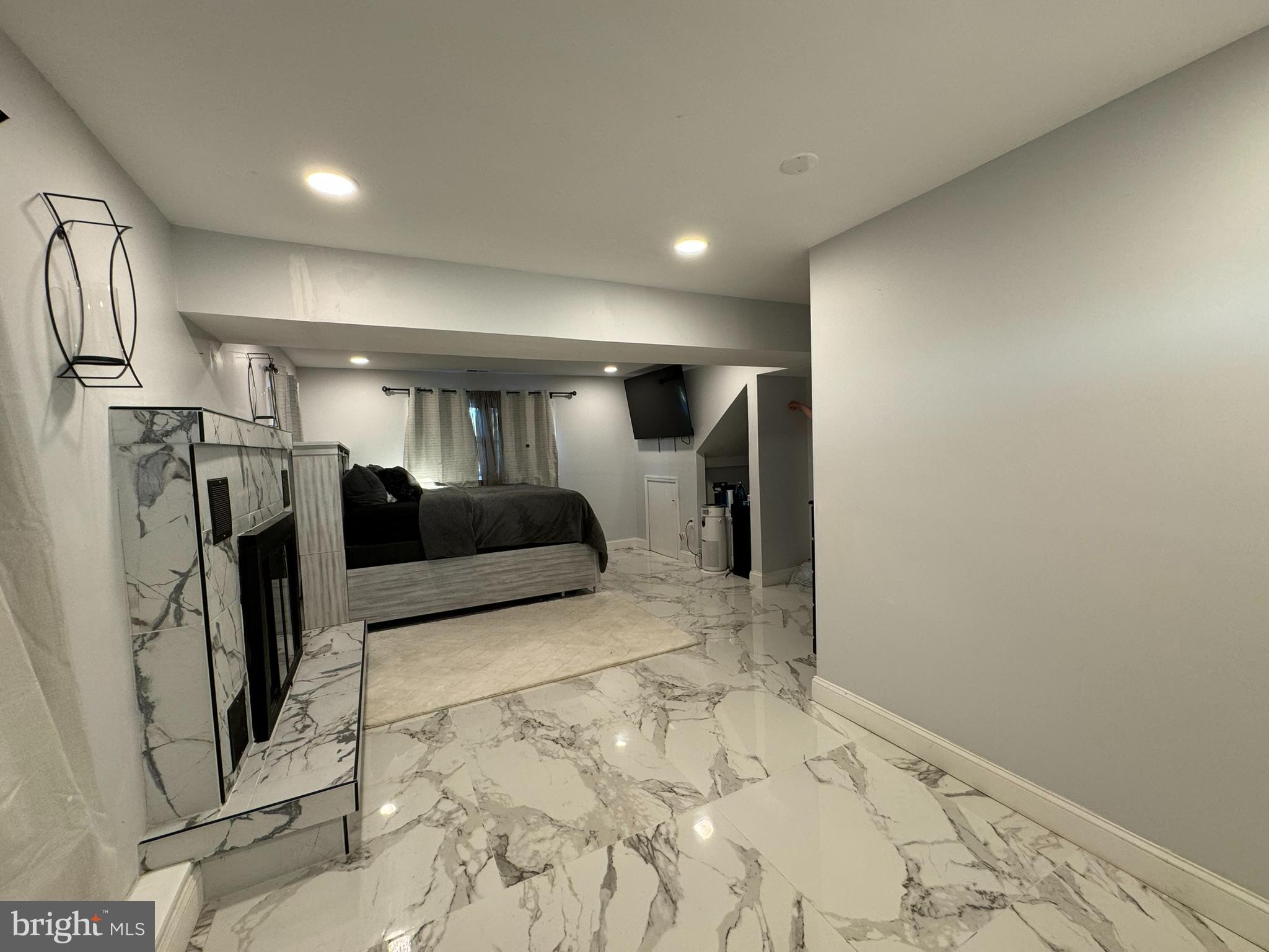 49 Delaware Drive Penns Grove, NJ 08069 - Photo 17 of 26 a view of entryway with a refrigerator and a window