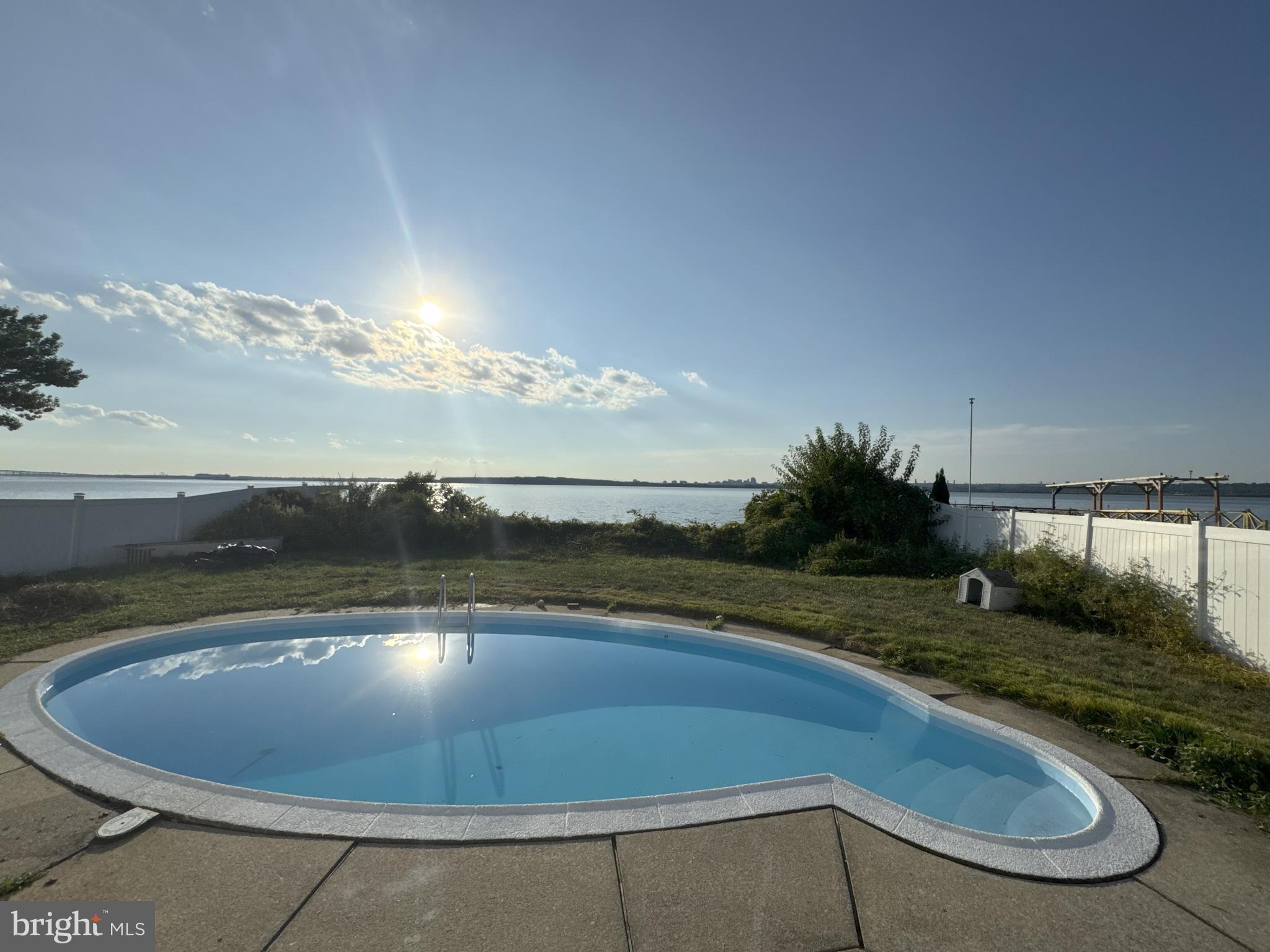 49 Delaware Drive Penns Grove, NJ 08069 - Photo 22 of 26 a view of a swimming pool with a yard