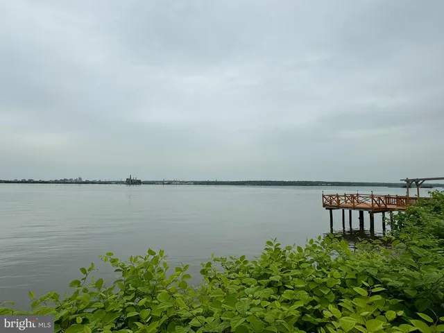an aerial view of residential house with outdoor space and lake view